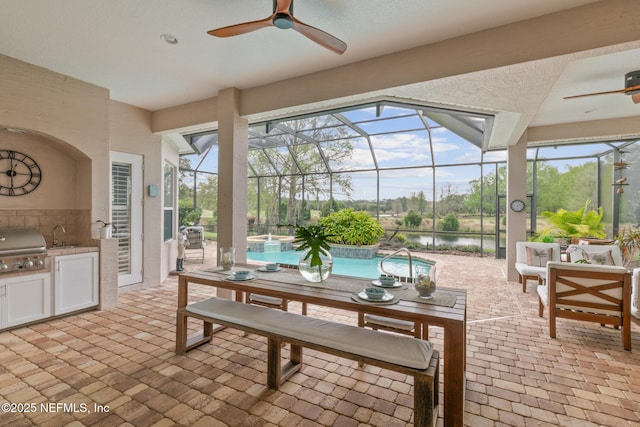 2095 Crown Dr, Saint Augustine, FL 32092 - view of patio featuring a ceiling fan, grilling area, exterior kitchen, and a lanai
