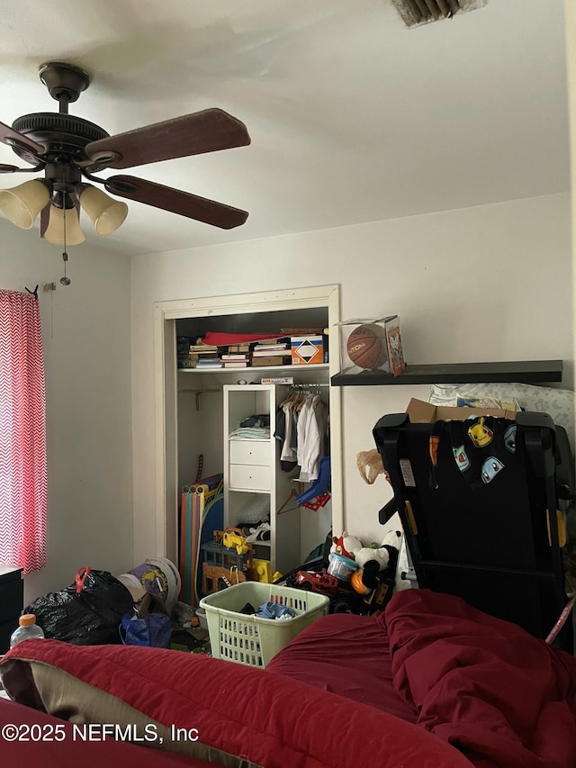 bedroom featuring a closet and ceiling fan