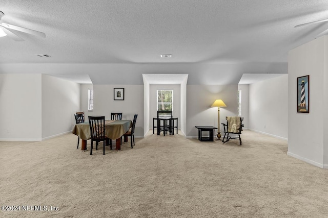 dining area featuring carpet flooring, ceiling fan, visible vents, and baseboards