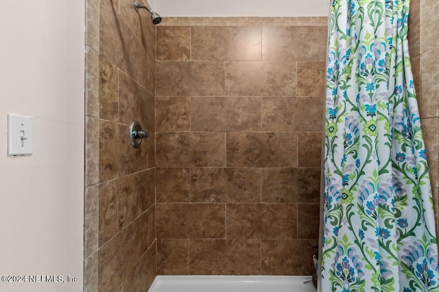 bathroom with a shower with curtain