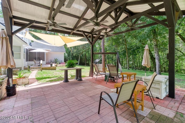 view of patio with a ceiling fan and a gazebo