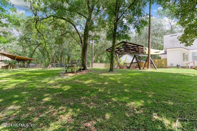 view of yard with a gazebo and fence