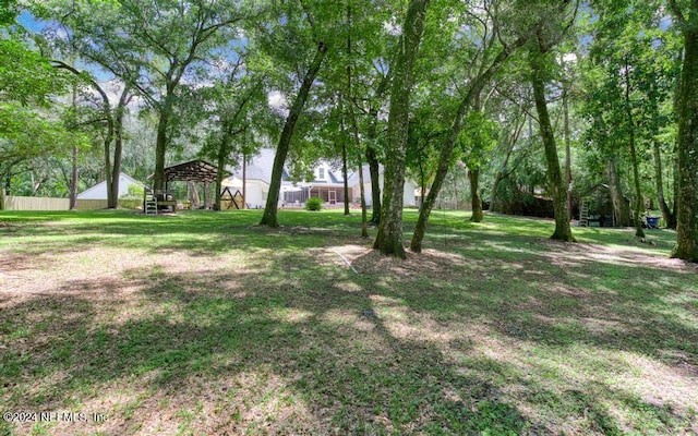 view of yard with a gazebo and fence