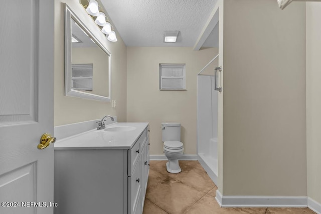 bathroom with toilet, a shower, a textured ceiling, and vanity