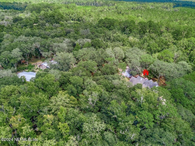 drone / aerial view with a view of trees