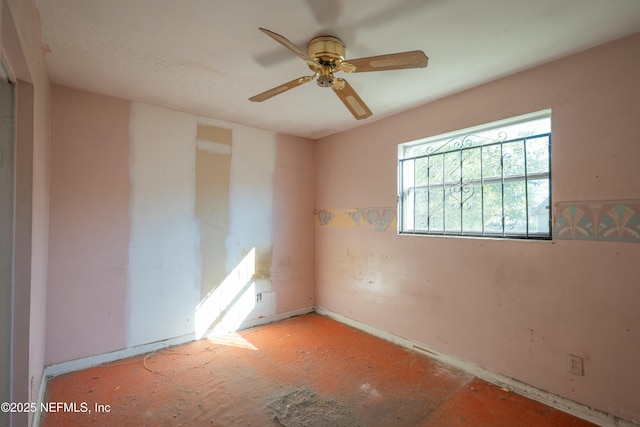 unfurnished room with ceiling fan