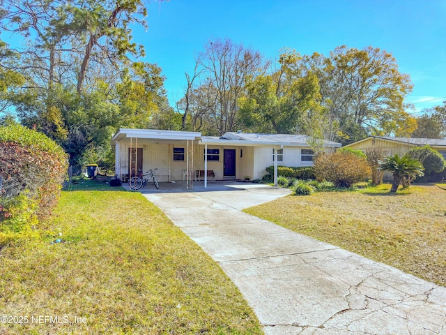 single story home featuring a carport and a front yard