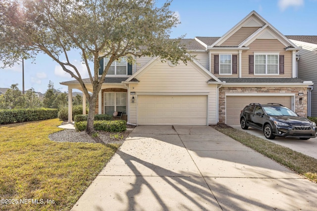 view of front of property featuring a garage and a front yard