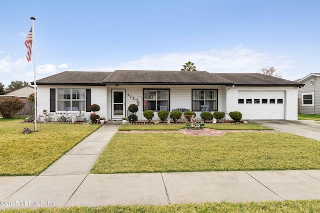 ranch-style home featuring a porch, a garage, and a front yard