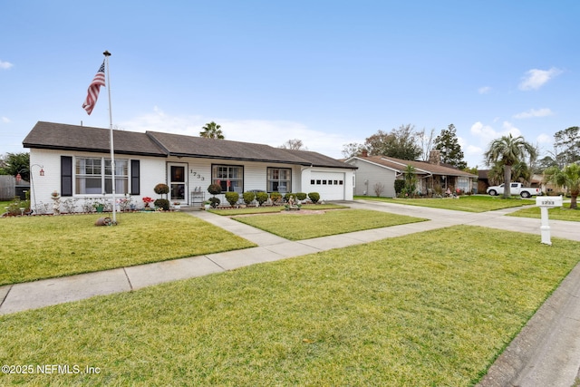 ranch-style house with a garage and a front lawn