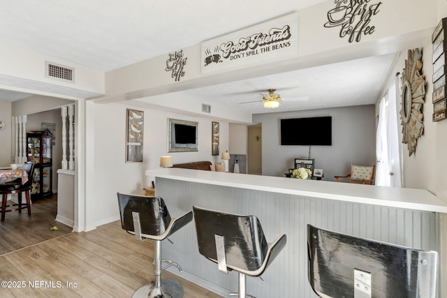 interior space featuring ceiling fan and light wood-type flooring