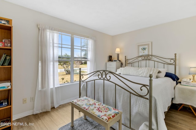 bedroom with light hardwood / wood-style flooring