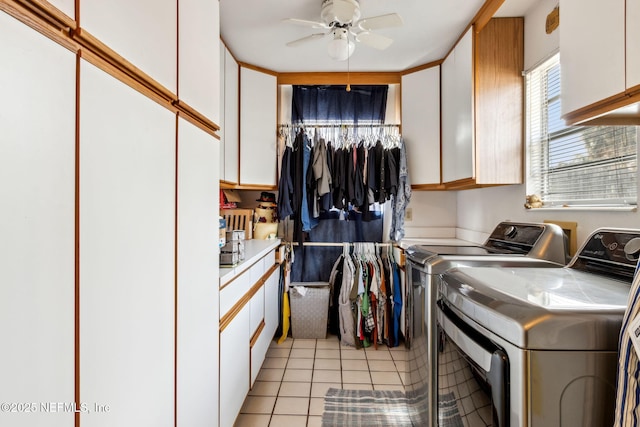 clothes washing area with cabinets, light tile patterned flooring, ceiling fan, and independent washer and dryer