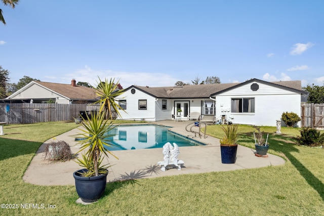 view of pool with a yard and a patio area