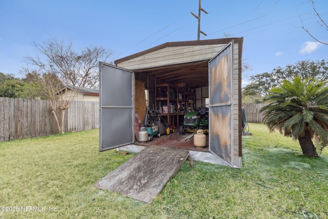 view of outbuilding featuring a yard