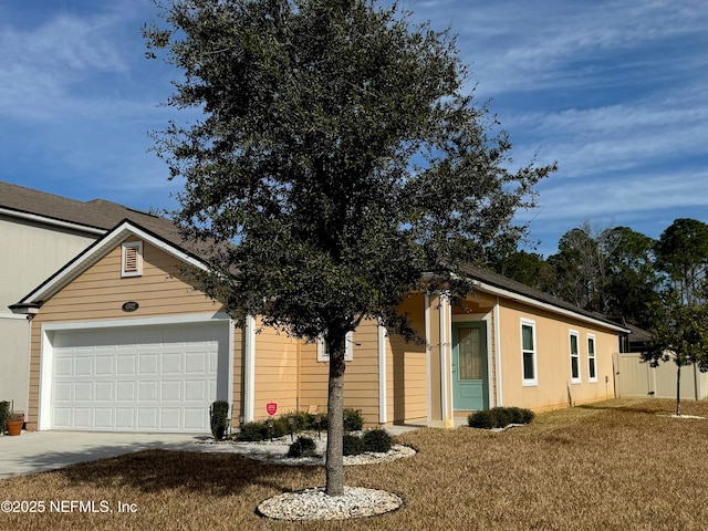 ranch-style home featuring a garage and a front yard