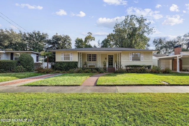 ranch-style house with a garage, a front lawn, and a porch