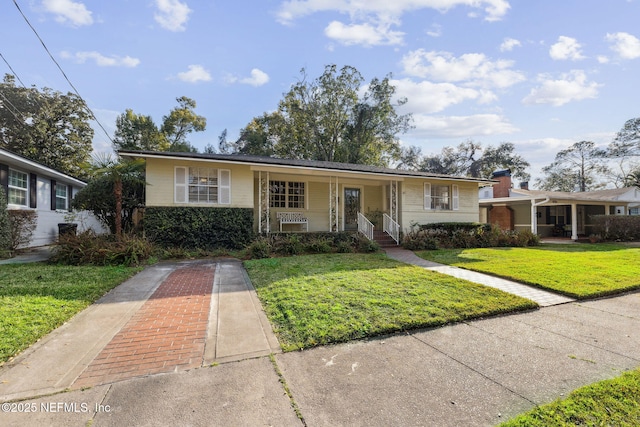 view of front of home with a front lawn and a porch