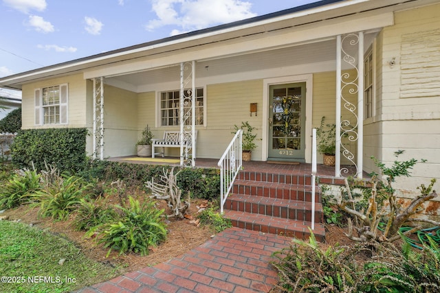 doorway to property featuring a porch