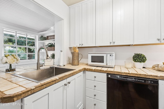 kitchen with white cabinetry, sink, tile counters, and dishwasher