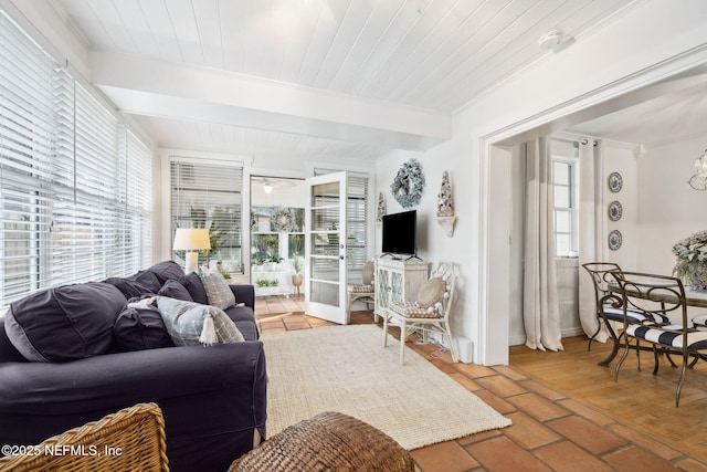 living room featuring crown molding, wooden ceiling, french doors, and beamed ceiling