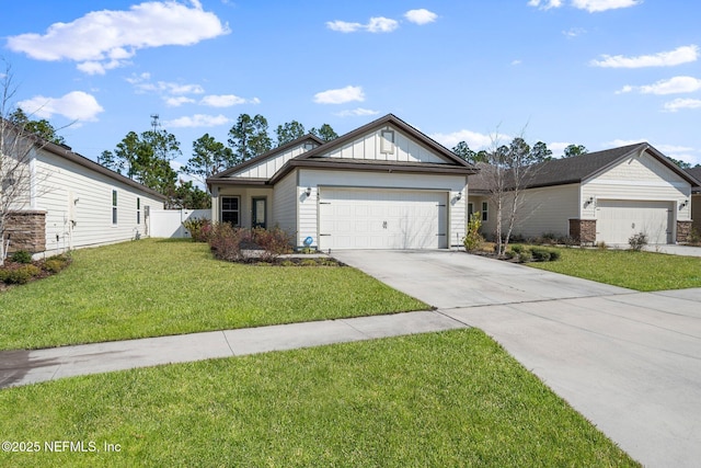 view of front facade with a garage and a front yard