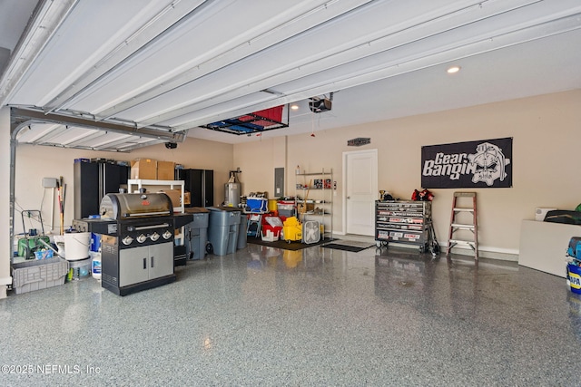 garage featuring a garage door opener and electric panel