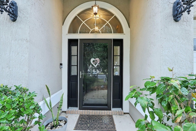 1336 River City St, Saint Augustine, FL 32092 - doorway to property with stucco siding