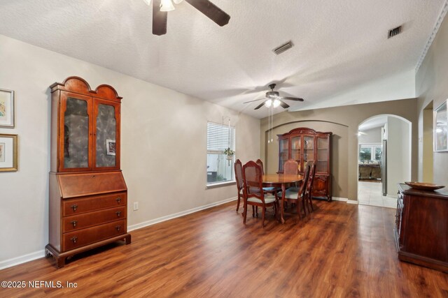 1336 River City St, Saint Augustine, FL 32092 - dining room with a textured ceiling, a ceiling fan, and dark wood-type flooring