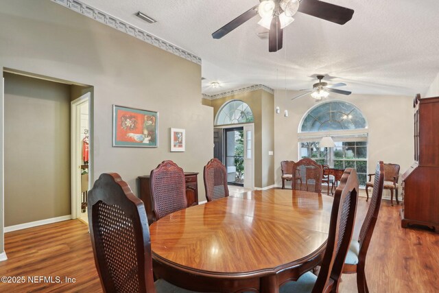 1336 River City St, Saint Augustine, FL 32092 - dining area featuring a textured ceiling, wood finished floors, visible vents, and baseboards