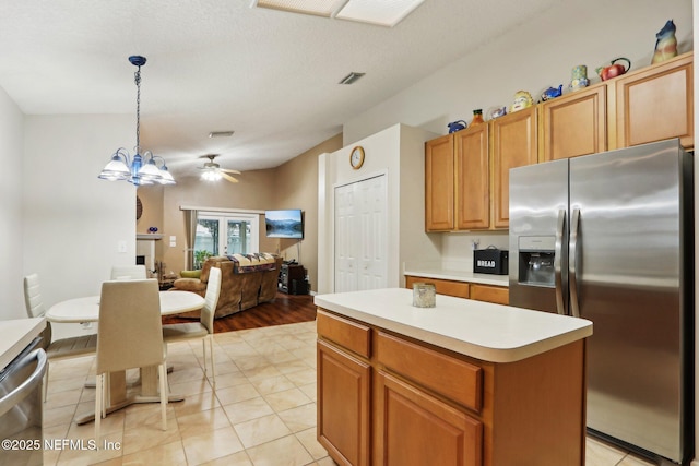 1336 River City St, Saint Augustine, FL 32092 - kitchen with a center island, pendant lighting, a fireplace, stainless steel appliances, and light countertops