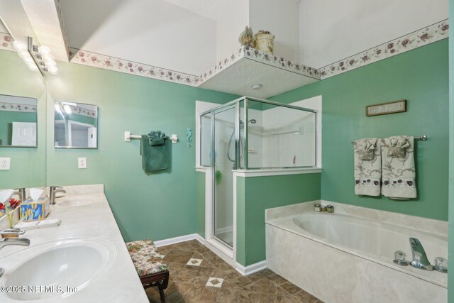 1336 River City St, Saint Augustine, FL 32092 - bathroom featuring a garden tub, a shower stall, and a sink