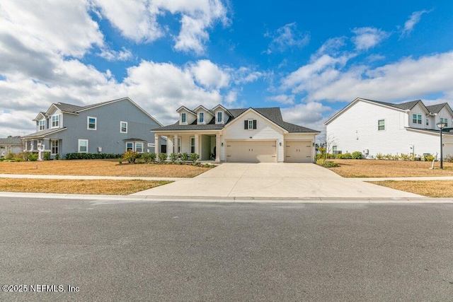 view of front of home with a front yard and a garage