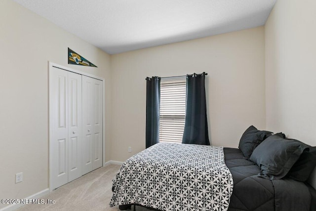 carpeted bedroom featuring a closet