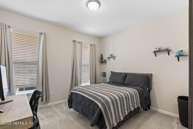 bedroom featuring light carpet