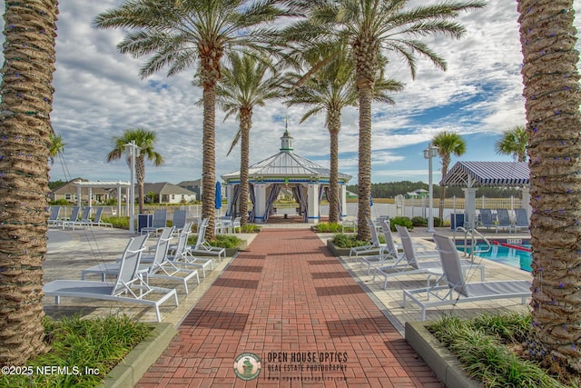 view of home's community with a patio, a swimming pool, and a gazebo