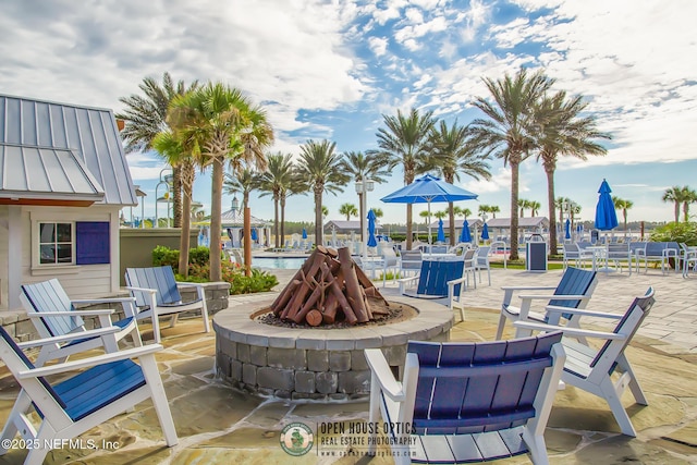 view of patio featuring a fire pit