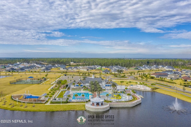 birds eye view of property with a water view