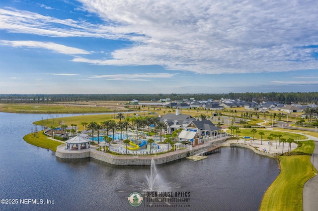 birds eye view of property with a water view