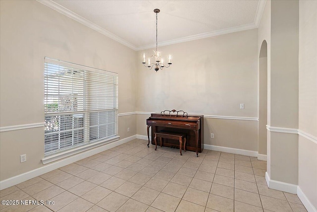 interior space with ornamental molding, light tile patterned floors, and an inviting chandelier