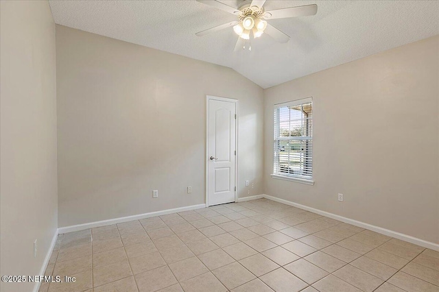 unfurnished room featuring light tile patterned floors, a textured ceiling, vaulted ceiling, and ceiling fan