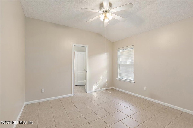 unfurnished room featuring light tile patterned flooring, ceiling fan, lofted ceiling, and a textured ceiling