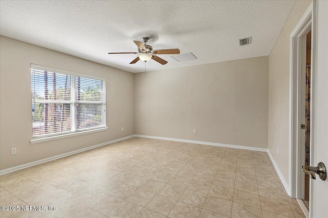 unfurnished room featuring a textured ceiling and ceiling fan