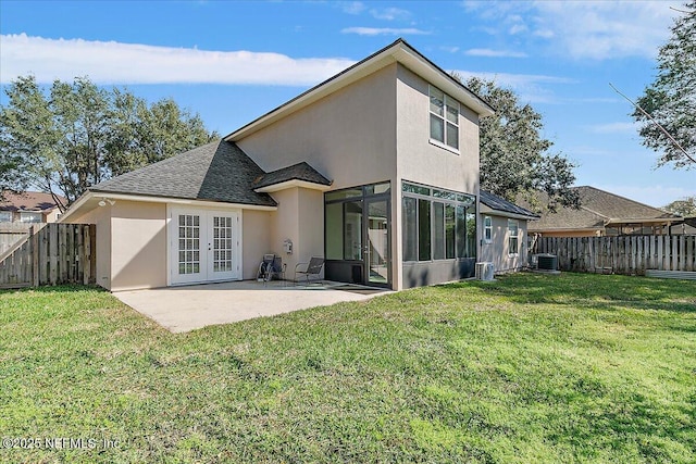 back of house featuring french doors, a yard, central AC unit, and a patio