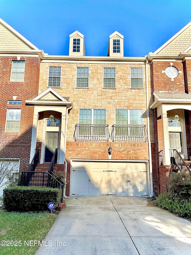 multi unit property featuring a garage