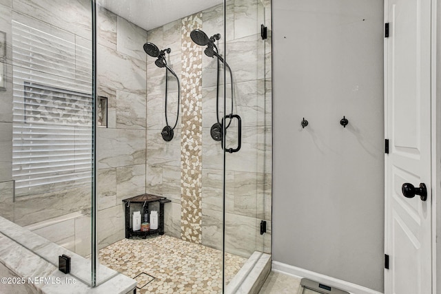 bathroom featuring a shower with shower door