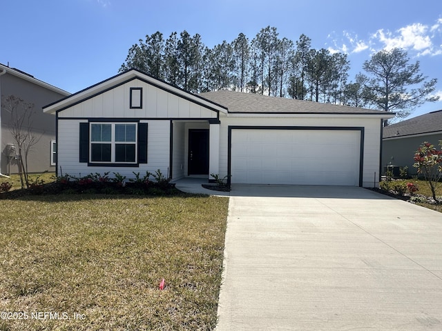 ranch-style house with board and batten siding, an attached garage, a front lawn, and concrete driveway