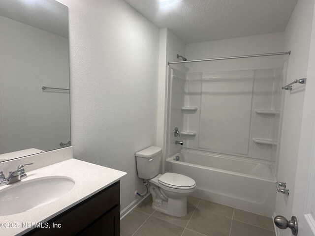 full bath with tile patterned floors, toilet, shower / tub combination, a textured ceiling, and vanity