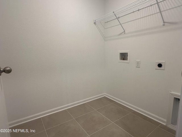 laundry room featuring electric dryer hookup, baseboards, hookup for a washing machine, and laundry area