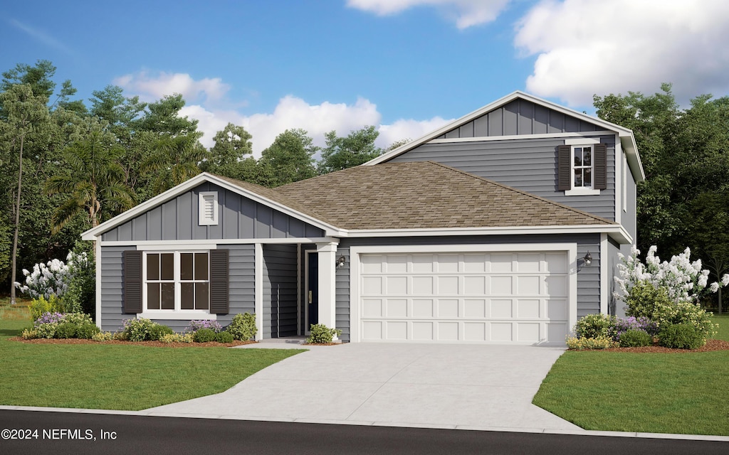 view of front facade with a garage and a front yard